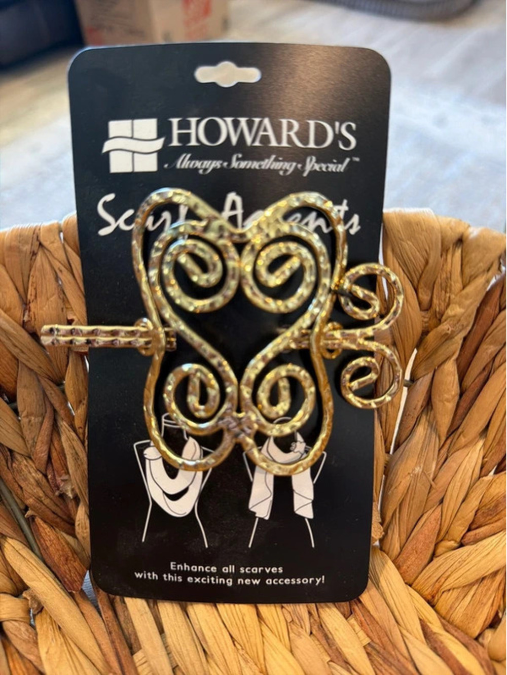 Howard’s scarf accent.   Gold scroll